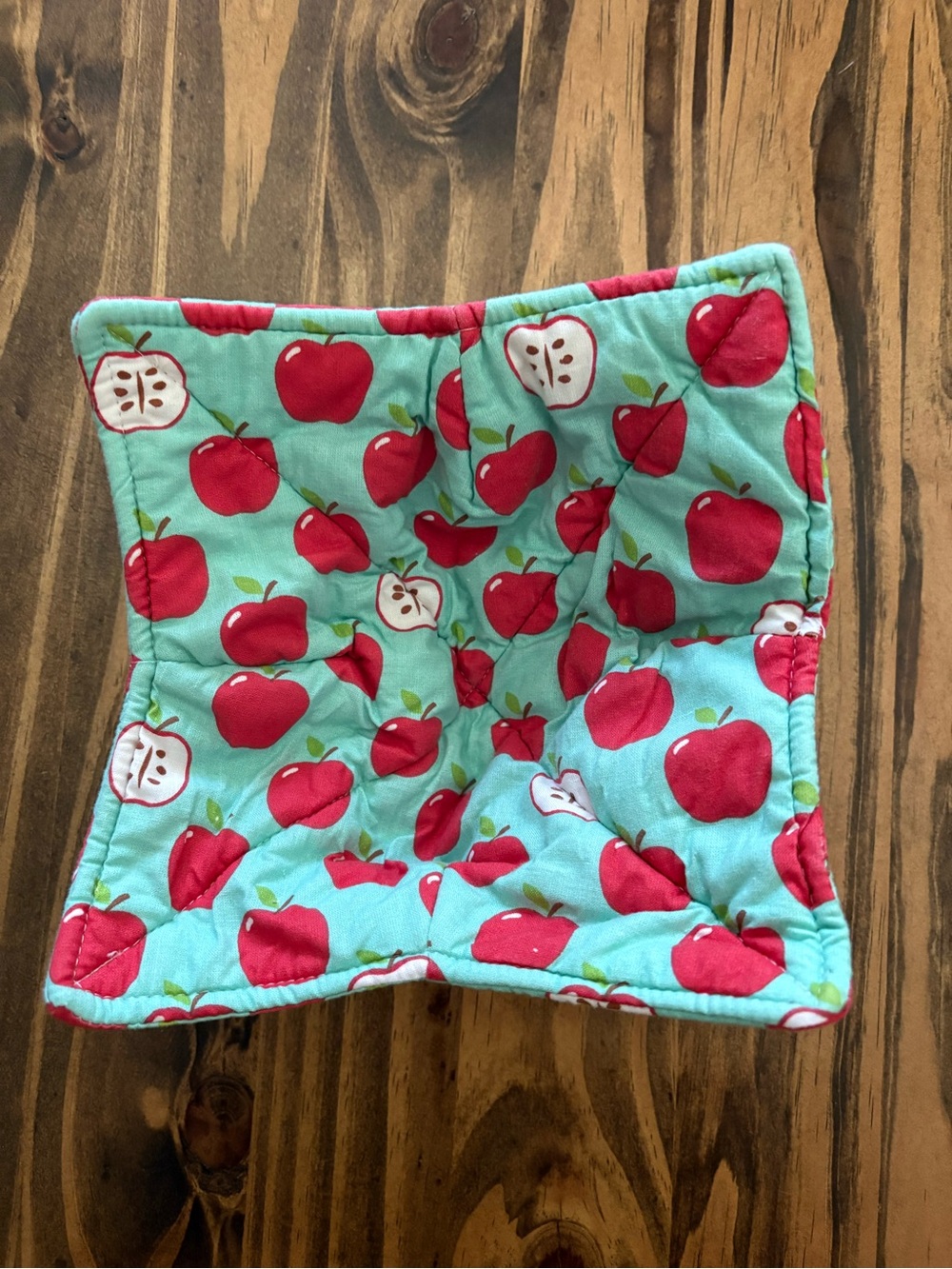 Quilted bowl cozy in classic Apple print with teal background cottagecore